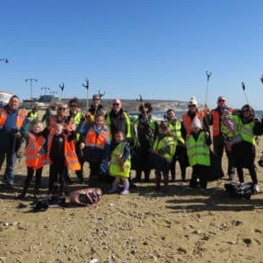 People litter picking on Sandown Beach