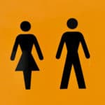 Black symbols for men's and women's toilets on a yellow background by massimo virgilio