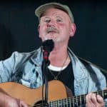 Antony John Clarke playing the guitar