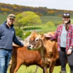 James and Becca with cows at Warren Farm Micro Dairy
