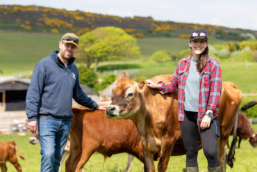 James and Becca with cows at Warren Farm Micro Dairy
