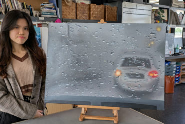 Janice with her painting of traffic in the rain