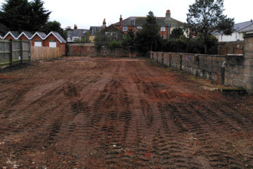 Looking through the Heras fencing at site on new street, newport