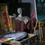 artists studio with paintings on easels