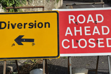 diversion and road closed sign