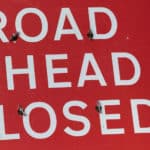 road ahead closed sign
