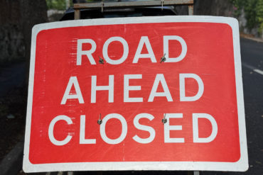 road ahead closed sign 2