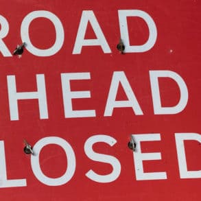 road ahead closed sign