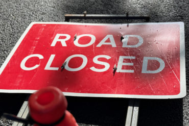 road closed sign on the floor