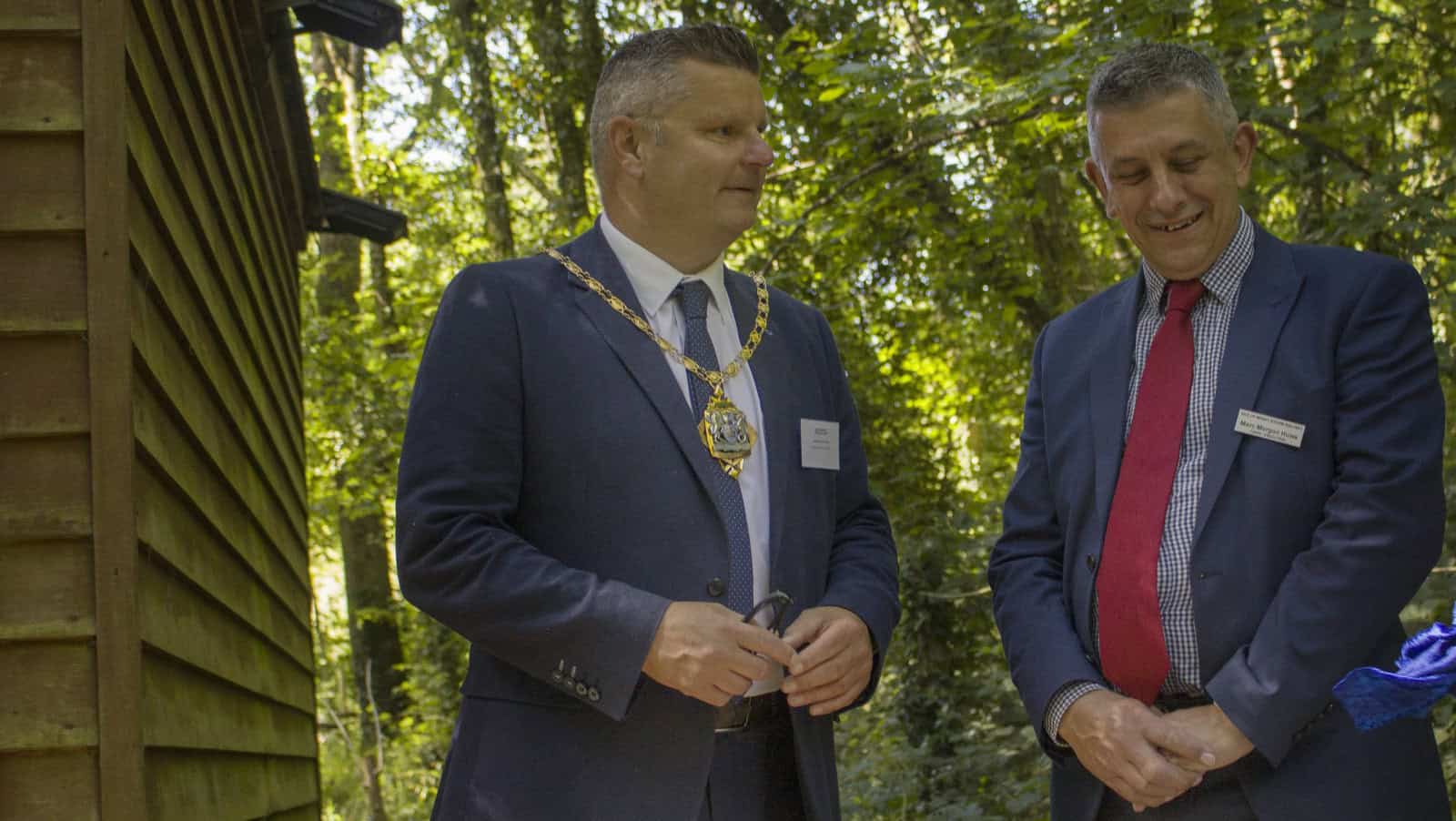 Ian Dore wearing chairman's chain at the new squirrel hyde at IW Steam Railway with Marc Morgan Huws