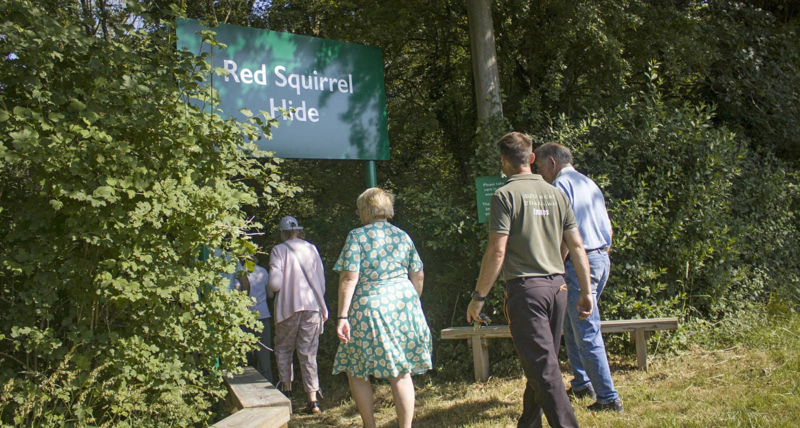 People walking towards the new squirrel hyde at IW Steam Railway
