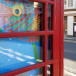 Close up of the painting of the wrasse in the telephone box window