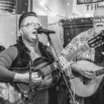 black and white photo of 'Second Time Around' performing in a bar