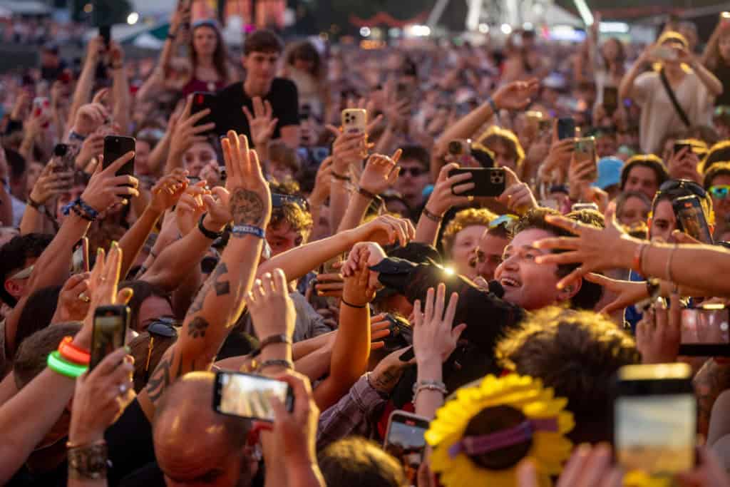 Lead singer of The Script surrounded by fans in the audience