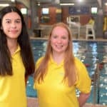 West Wight Sports & Community staff Izzy Taylor Receptionist, Lifeguard and Instructor and Emily Mann Fitness Instructor by the Swimming Pool