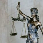brass statue of lady justice