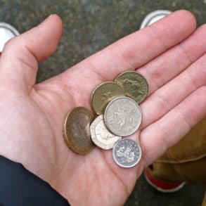coins in the hand of person