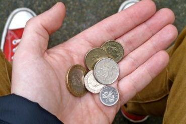 coins in the hand of person