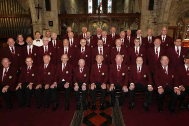 Newchurch male voice choir in a church