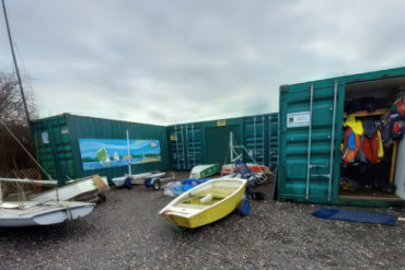 The existing sea view boat yard with containers and boat