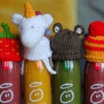 Bottle of innocent juice with knitted hats