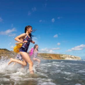 Children splashing in water at Yaverland