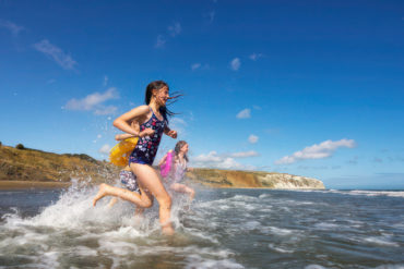 Children splashing in water at Yaverland
