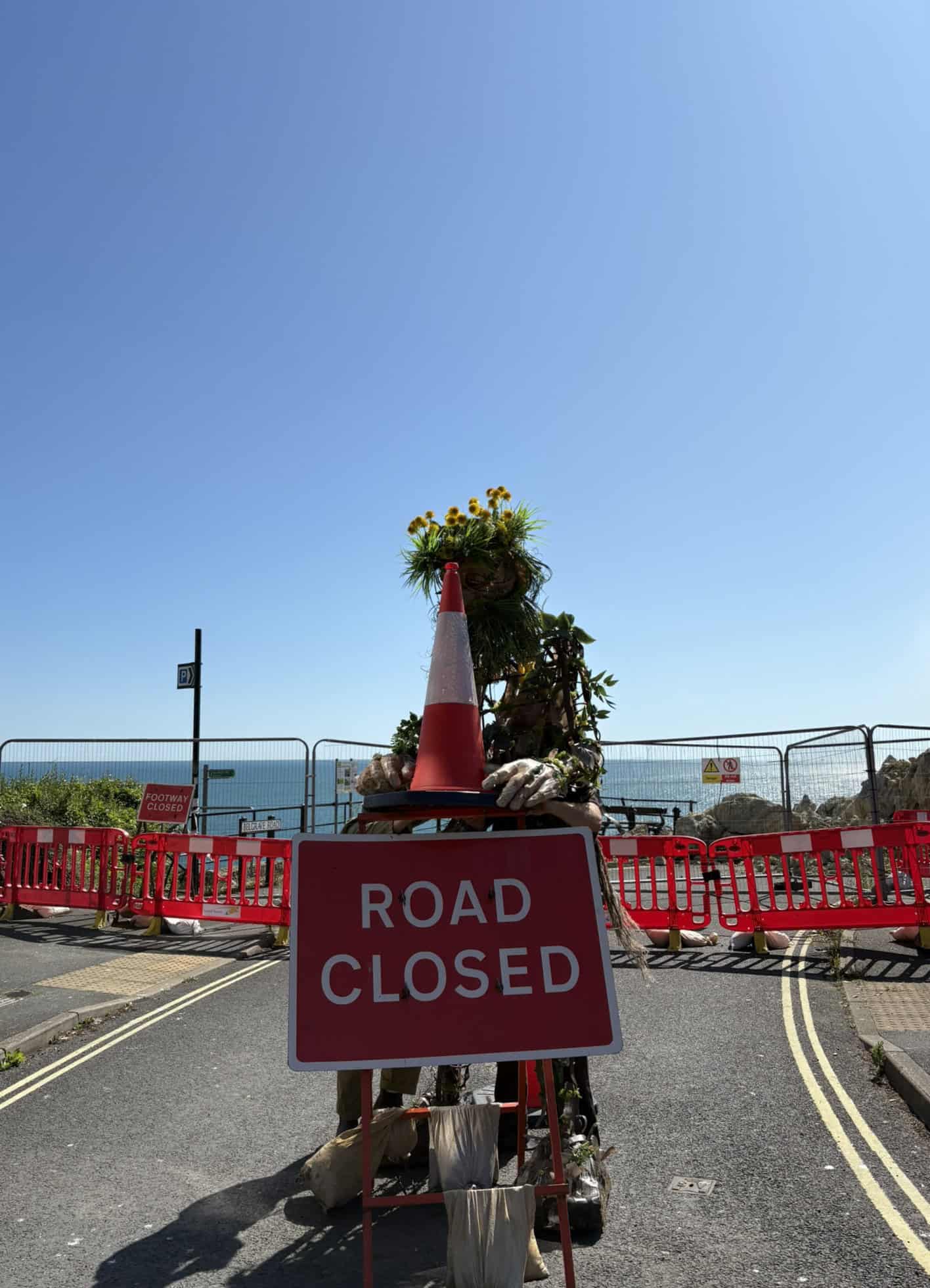 Daniel with the road closed sign