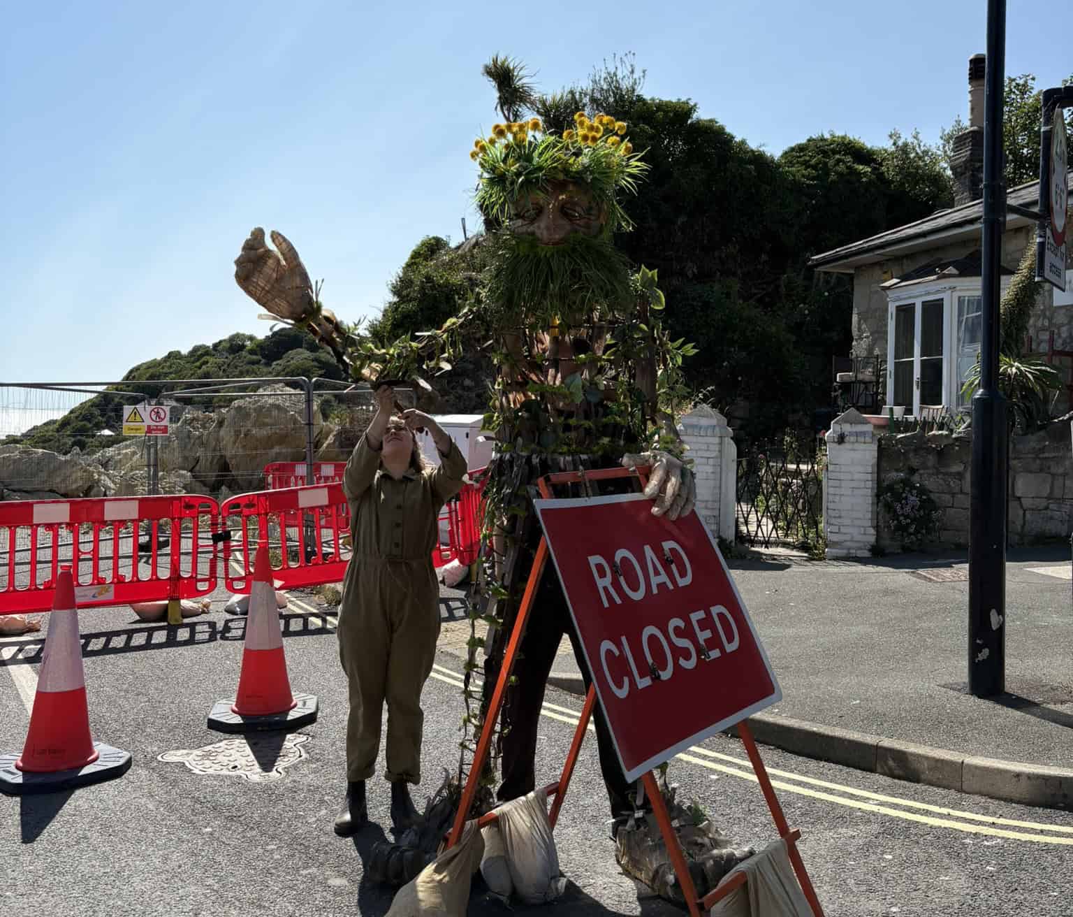 Daniel with the road closed sign