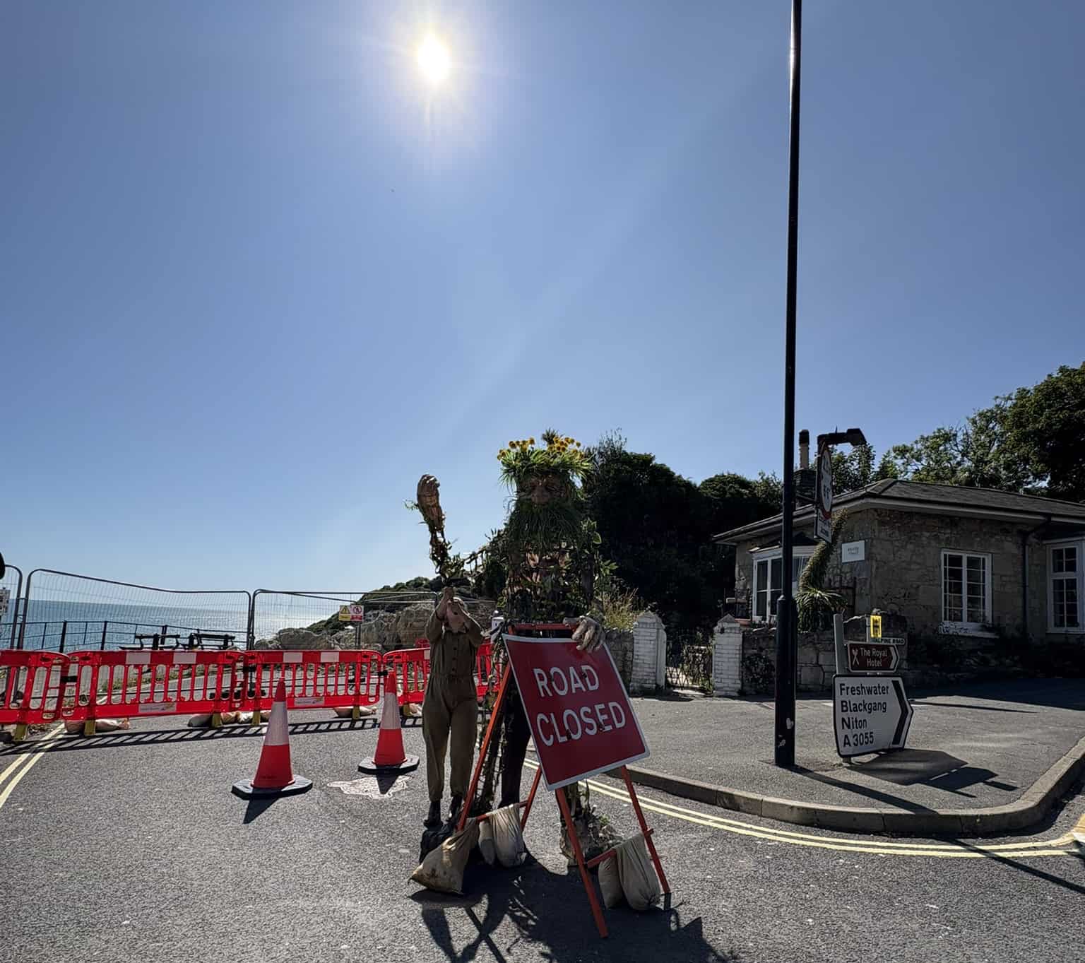 Daniel with the road closed sign