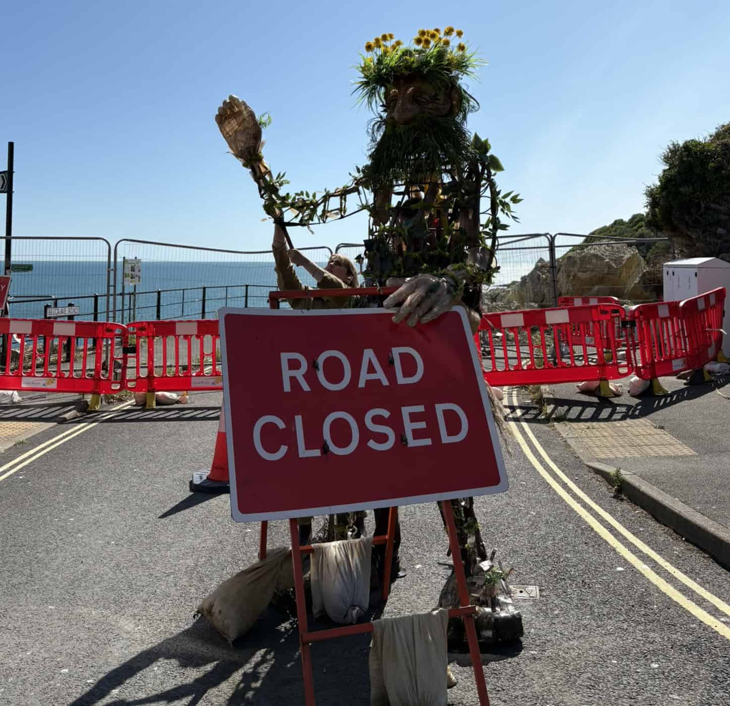 Daniel with the road closed sign