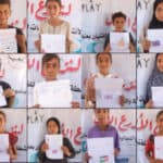 Gazan children holding up their drawings