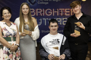 Ros parker with three students who received awards