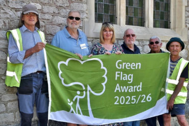 Volunteers with the Green Flag at Northwood Cemetery