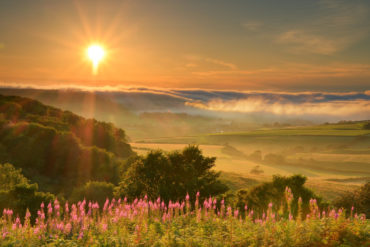 View from Ventnor Down with sun shining through hazy clouds