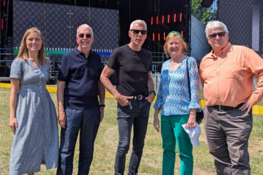 Standing in front of the main stage at IW Festival - Claire Ford, David Curtis-Brignell, John Giddings, Victoria Borwick, Will Myles