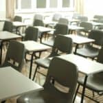 school desks and chairs in a classroom