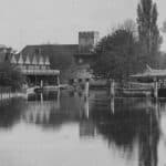 An historic black and white photograph showing the boathouse