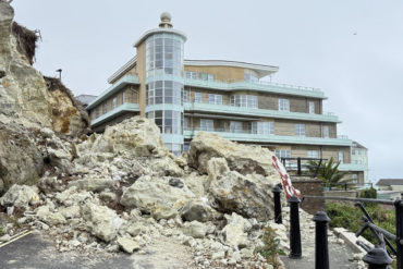 Belgrave Rock overhang rock debris in road looking east