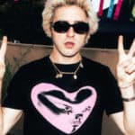 Punk wearing one of the new T-shirts showing a neon pink love heart on the front