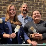 Volunteers with paint brushes outside the Church Close Community Centre