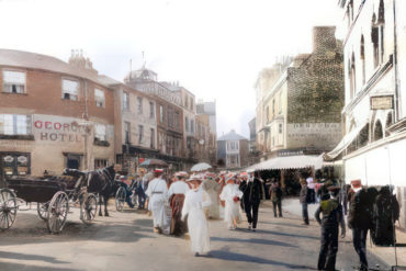 Cowes Boozer book cover showing painting from Victorian period of people walking in the street past an ale house