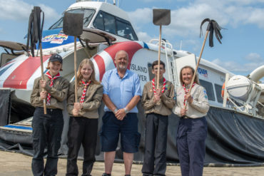 Explorer Scouts with their firebeaters made from old hovercraft rubber skirts