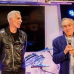John and Ray giving speeches at Experience 25 event