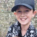 Logan smiling at the camera