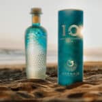 Mermaid Gin tenth anniversary bottle on the beach
