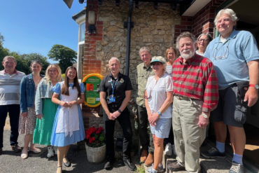 Wight Strollers (including left to right: Chair David Kast, Emily Scotcher, Izzy Rudd and Madeline Walker ‘Alice’, Duncan from Isle of Wight NHS Trust Ambulance Training & Community Response Services, and members of Brook local community)