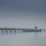 Photo of a pier during a misty day