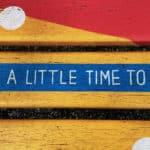 painted wooden boards with the words 'take a little time to think' painted onto them