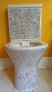 Black and white doodle on a loo in a yellow room